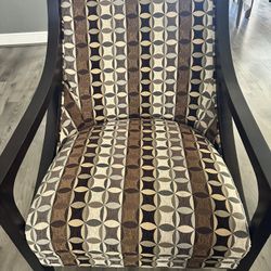Side Brown Fabric Chair With Geometric Shapes On It
