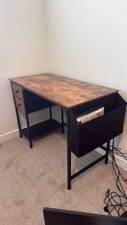 A 40’ desk with 2 drawers, bottom shelf, and a storage side bag