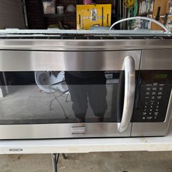 One Silver Microwave One Black Microwave, One Mini Refrigerator, Black And 2 Restroom Sinks, And One Battery Charger 24 V