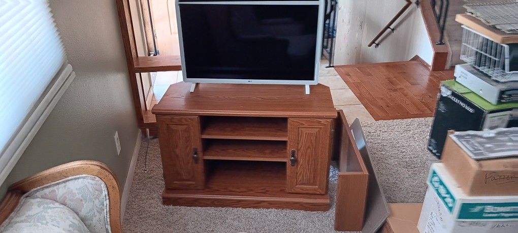 LG Smart TV and Entertainment Stand