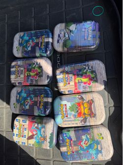 POKEMON tins. Sealed new