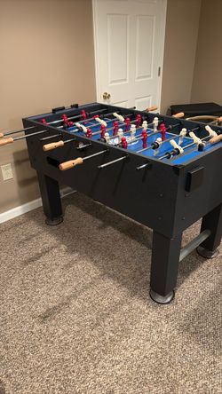 Foosball Table with Red and White Players