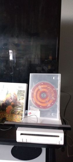 Nintendo Wii With Games One Controller And A Nunchuck