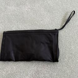 New black zippered travel pouch with a wristlet strap makeup bag