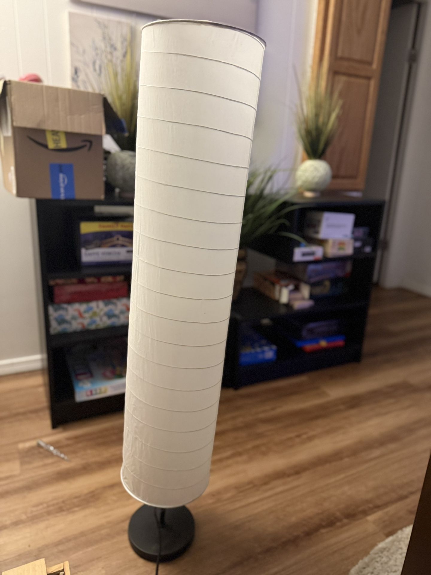 Super cute slender cylinder like tall room lamp. Works great nothing wrong with it.