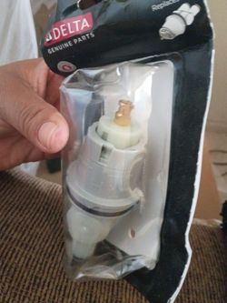 Delta genuine parts tub and shower faucet cartridge, model RP46074, sealed in its original clear plastic and black packaging