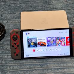 Nintendo switch Oled with docking station, charger and Joycon grip. No trades cash only.