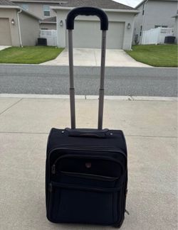 Selling a black fabric carry-on suitcase, 21x14x9.5.
