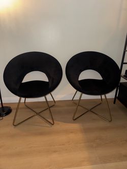 Two black velvet chairs