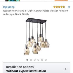 Light Fixture - JojoSpring Mariana 8 Light CognacGlass Cluster Pendant. Used great condition. Fully Assembled, 1 new replacement glass from original