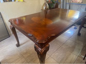 Brown table and  6 chairs