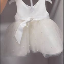 White party dress with pearls on it