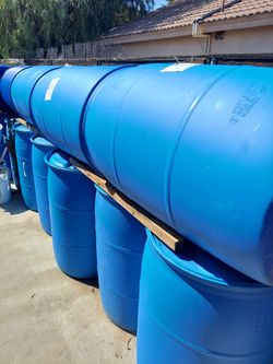 Food grade plastic water barrels.