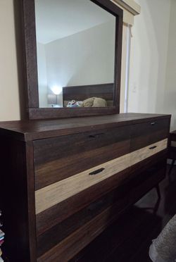 Dresser w/mirror and a TV console with TV on