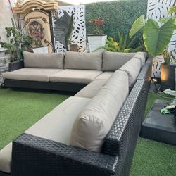 Beautiful rattan patio set in perfect condition. The cushions are Sunbrella brand and of very high quality; this furniture comes from Costco.