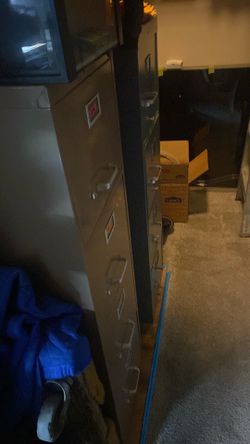 File cabinet 4 drawers with lock 52”x15”x27”deep one gray one tan in very good condition