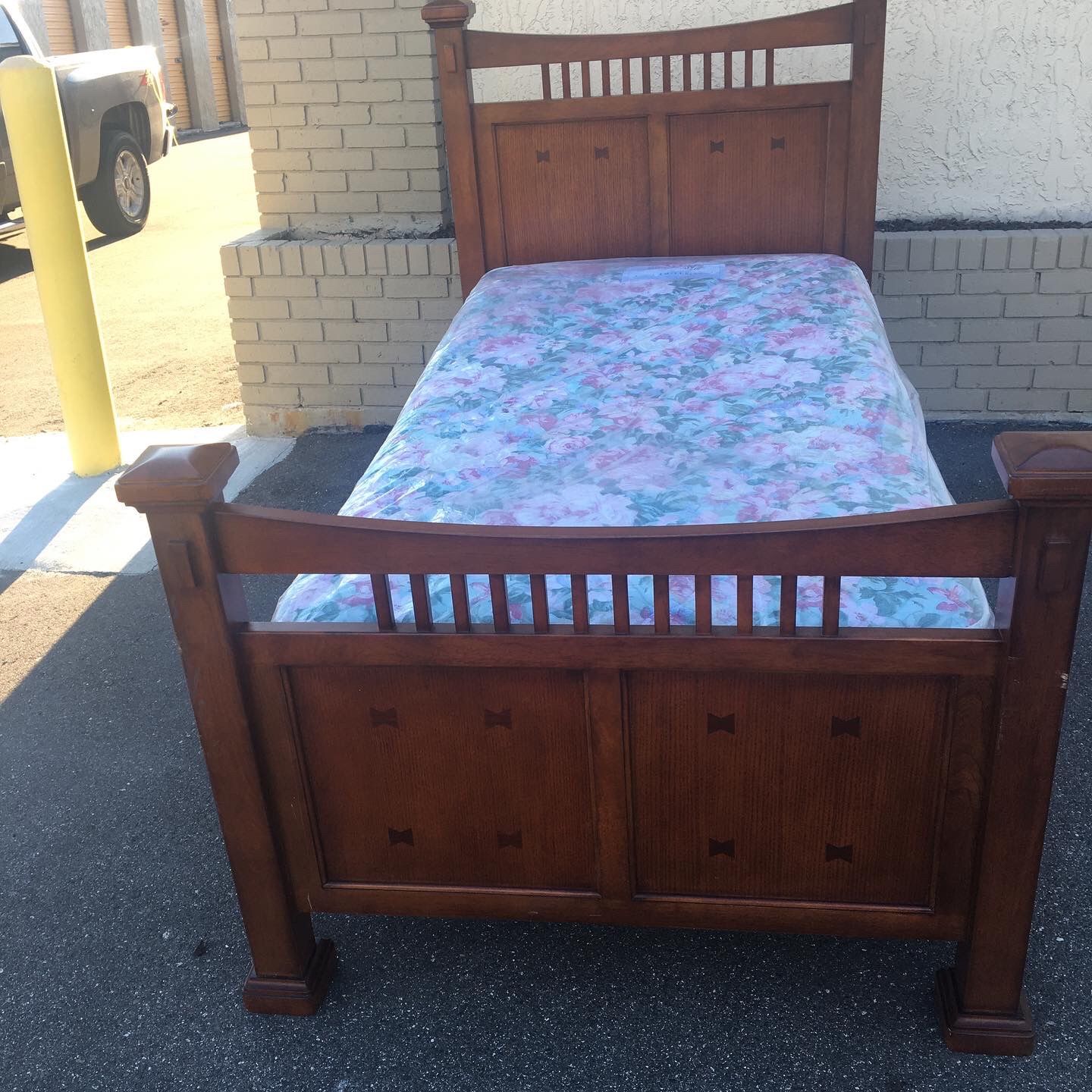 Twin size solid wood bed frame with brand new twin size mattress and box spring still in plastics