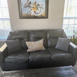 Gray Leather Sofa, Love Seat, And Futon 