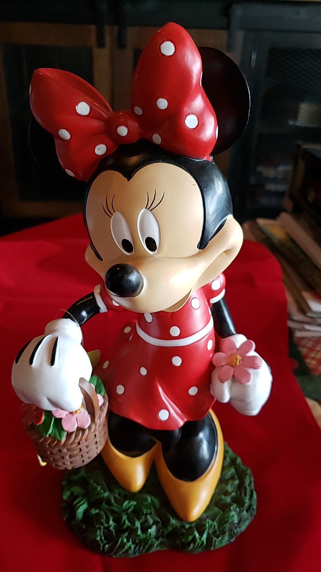 Minnie Mouse with flower basket almost 13 inches tall. Like new very cute.