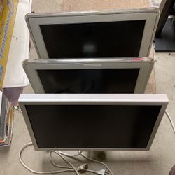 Three Apple Monitors 20” 23”