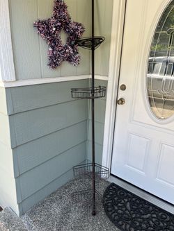 Adjustable spring loaded shower caddy
