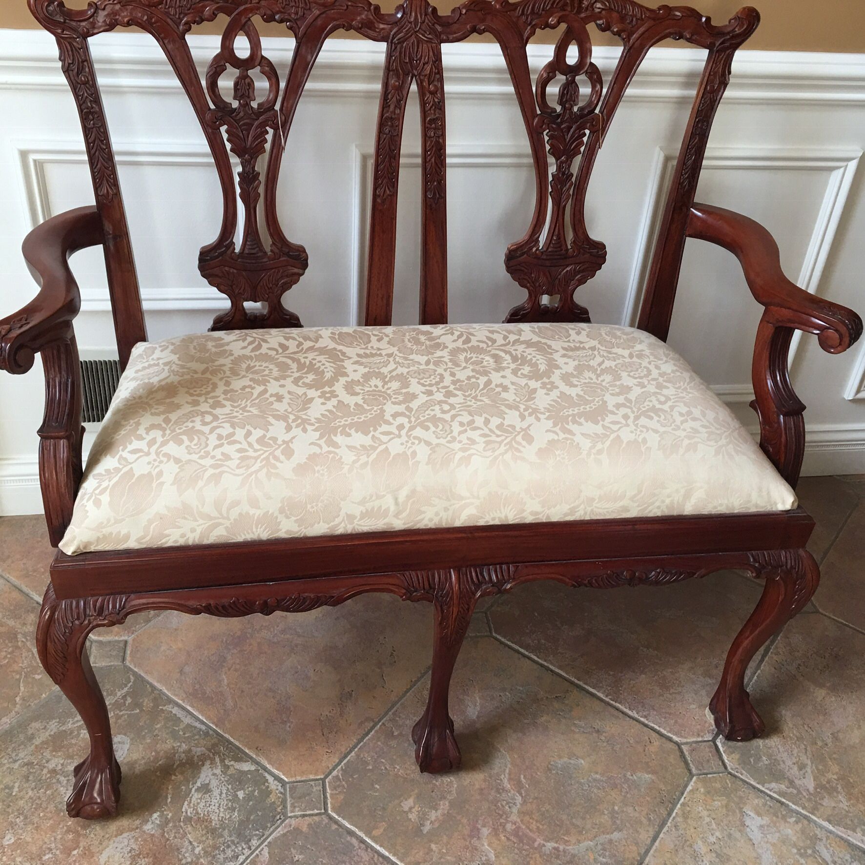 Traditional mahogany bench with pretty damask fabric.