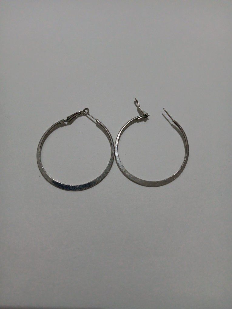 silver tone 2 in." flat hoop fashion earrings 