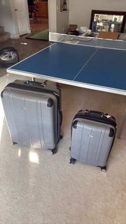 2 expandable rolling suitcases