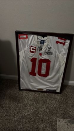 Number 10 Eli Manning jersey in a picture frame