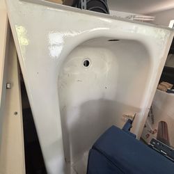 New Porcelain Enameled Steel Tub Left hand Drain. 