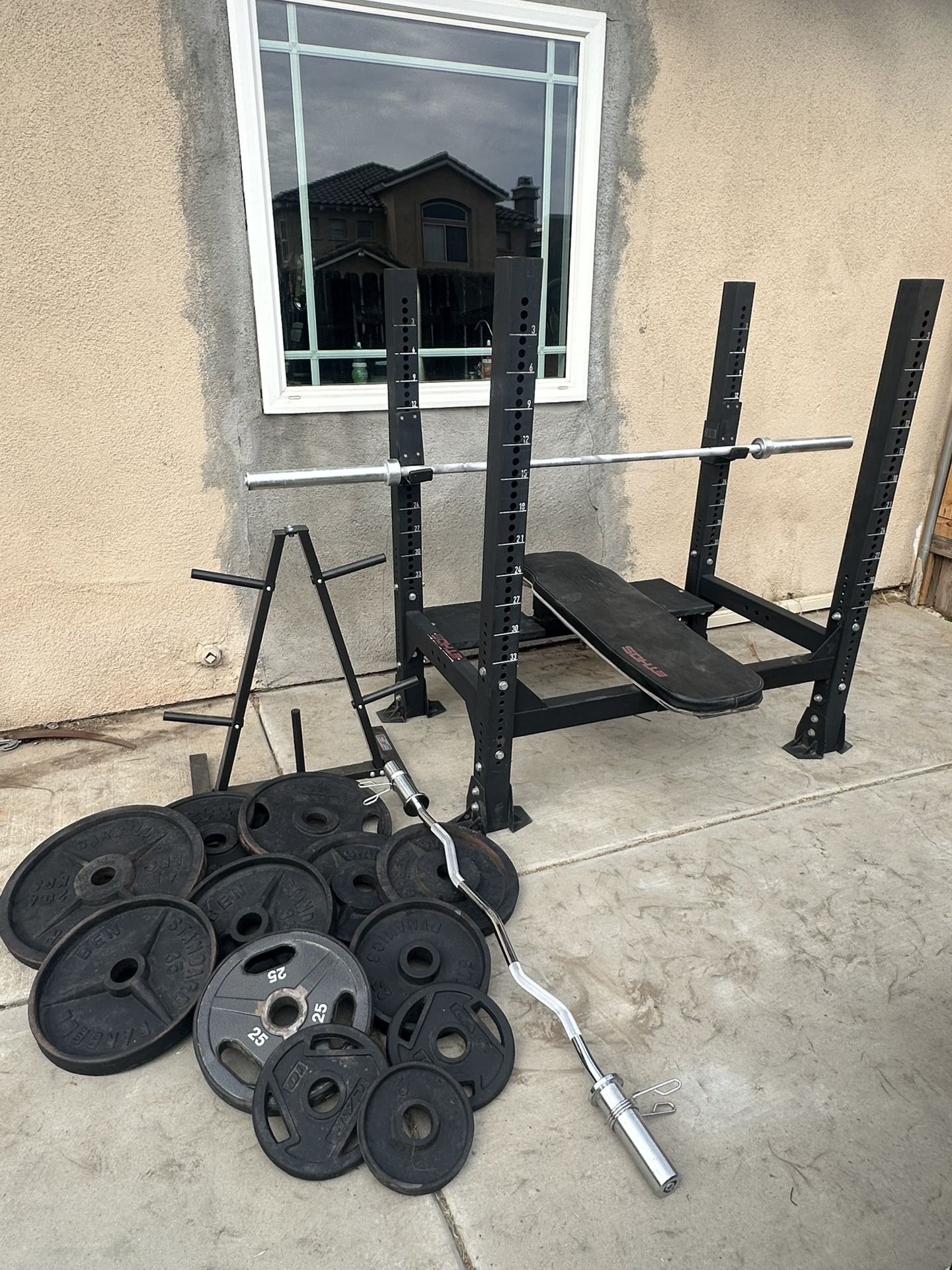 Ethos Bench press with 7ft bar plus 340lbs of Olympic weights and curl bar plus weights tree