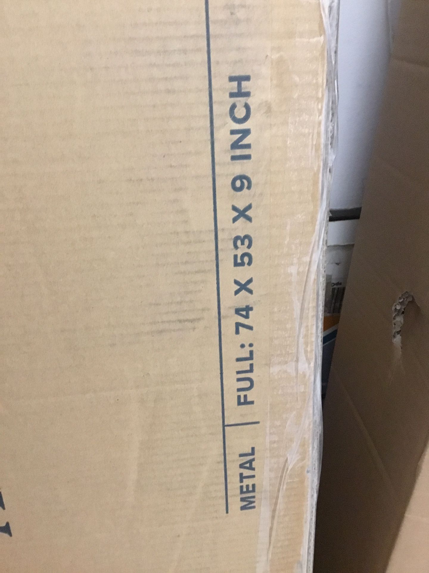 Full size bed frame is new in box