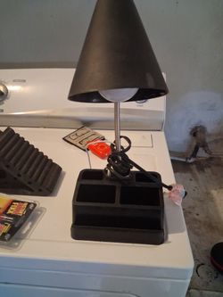 Desk top flex able light with USB connections go charge phones