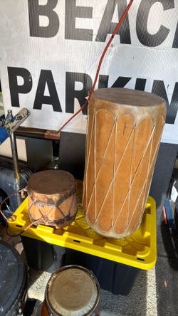 2 double headed , animal skin stretched conga type drums