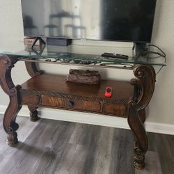 Wooden console table with glass top 