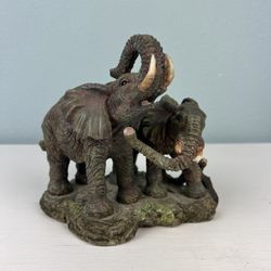 A Pair Of Ceramic Elephants 