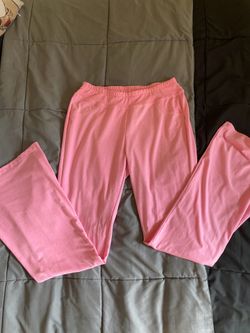 Pink women’s high-waisted leggings with a stretchy waistband