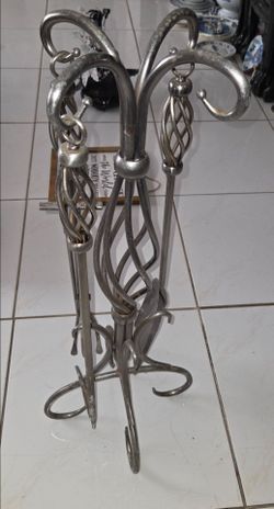 Vintage twisted silver‑toned wrought iron fireplace tool set, 3‑piece tools with stand, 31" tall, 12" wide. Includes shovel, tongs and poker, decorati