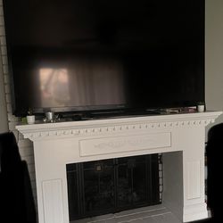 75” sharp tv and fireplace mantel