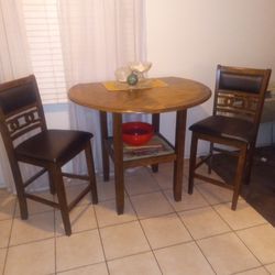 Two chairs and round table.