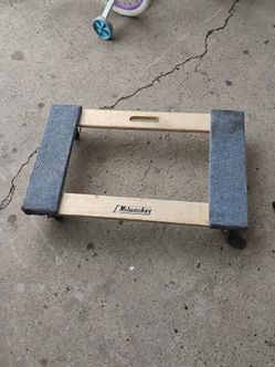 Milwaukee 1000-lb Capacity Wood Dolly with carpeted ends for protection.
