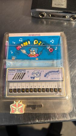 This is a vintage Electron Echo mini piano toy, also known as the CAL-TECH, INC. Mini Piano CT-01.  It was a popular electronic pocket keyboard toy fr