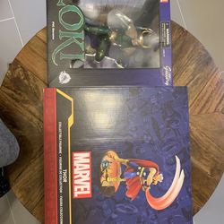 Two figures Marvel Thor And Loki