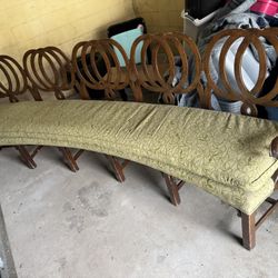 Antique Wooden Curved  Padded Bench  124 3/4” long  22 1/2” deep  21” floor to seat  40” tall in back 