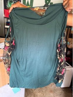 Women’s blouse with floral sleeves and cut out shoulders