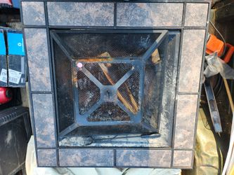 Woodburning fire pit with canvas cover