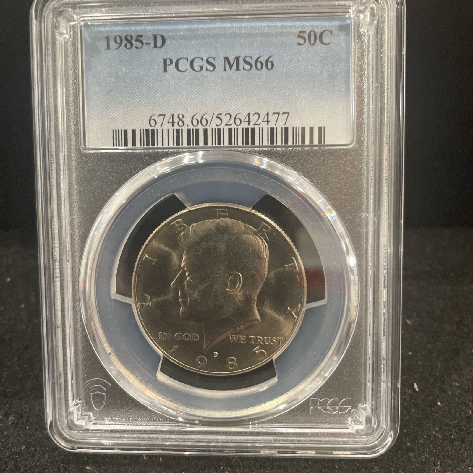 1985 D Hem Uncirculated Kennedy Half Dollar Graded By PGCS At MS66 O-1