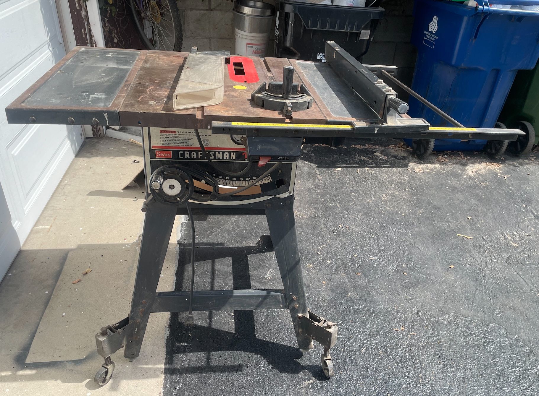 Craftsman portable job site table saw with a folding stand.