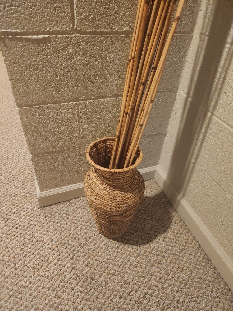 Wicker basket and bamboo sticks