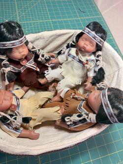 Collectible Ceramic Native American dolls and basket